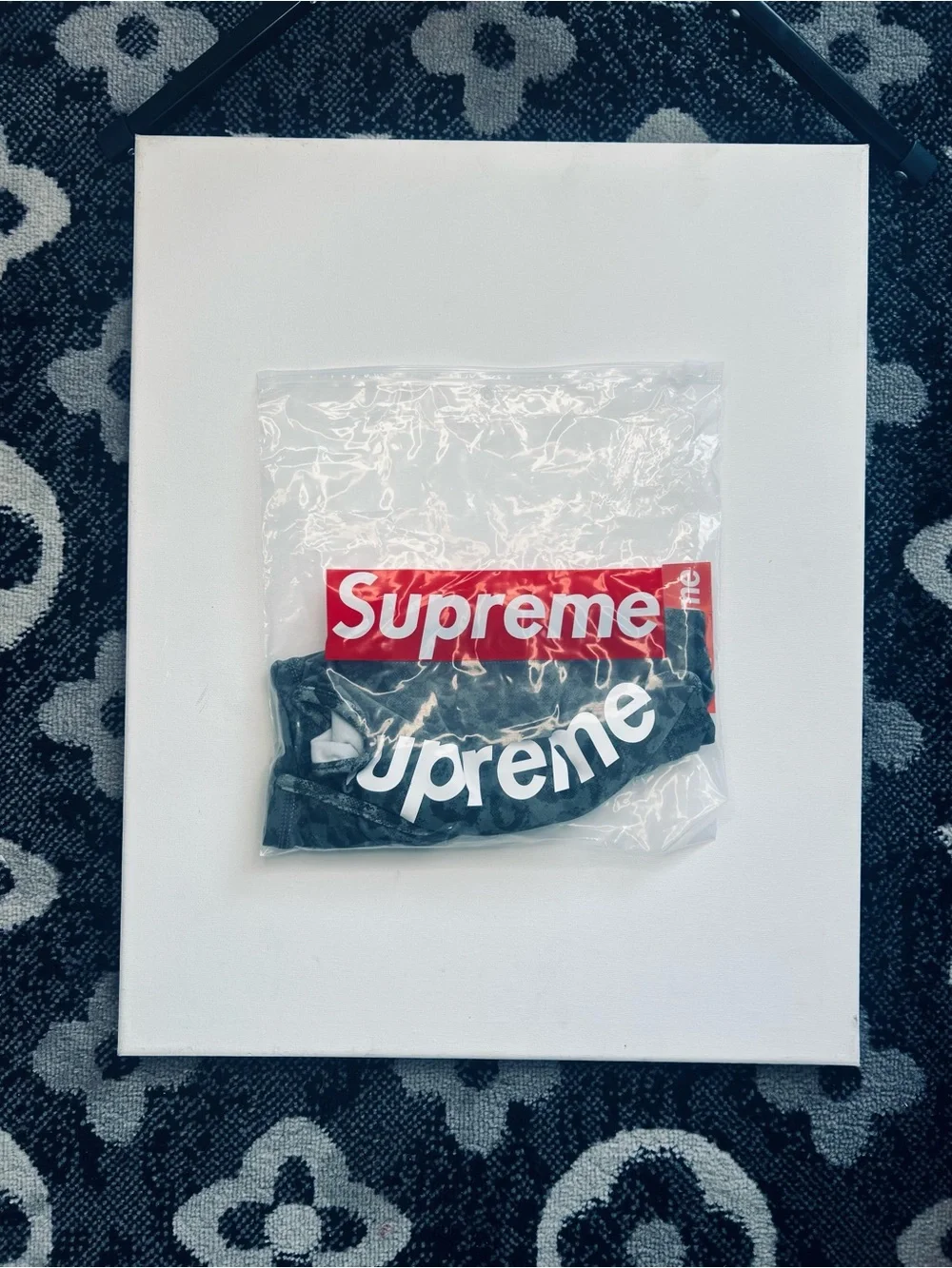 Supreme Black Face Mask with White Logo and Red Tag